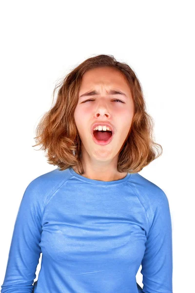 Teenager girl in a classic blue T-shirt screams in pain with her mouth open Stock Picture