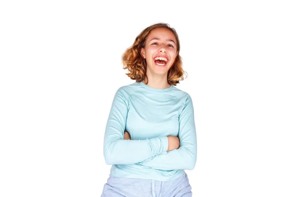 Beautiful young girl with curly hair crazy laughs with open mouth. Happy teenager, isolated — ストック写真