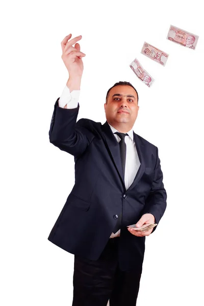 正式な服装のビジネスマンは紙幣を投げ出す — ストック写真
