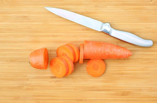 Cutting Carrot for cooking on wood block — Stock Photo, Image