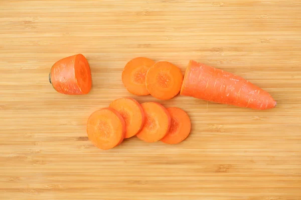 Cutting Carrot for cooking on wood block — Stock Photo, Image