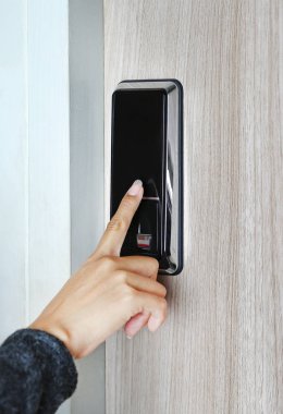 Fingerprint used as an identification method on a door lock clipart