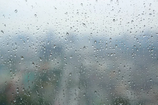 Streszczenie tło, krople wody na szkło okienne, deszczowy dzień — Zdjęcie stockowe
