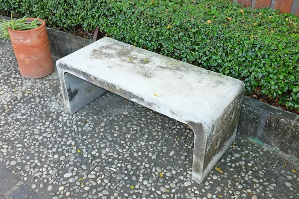 Cement chair in a garden — Stock Photo, Image