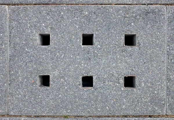 Cover of water drain on the road to collect raining water for sewage system, Top view. — Stock Photo, Image