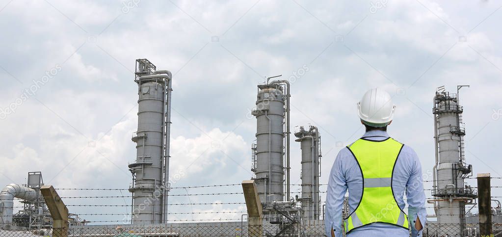 Male construction worker against gas separation plant