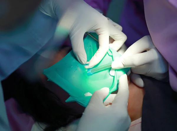 Little girl during dental extraction