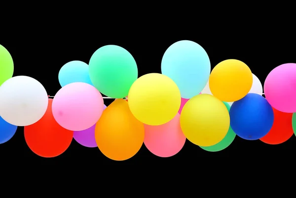 Kleurrijk ballon geïsoleerd op zwarte achtergrond. — Stockfoto