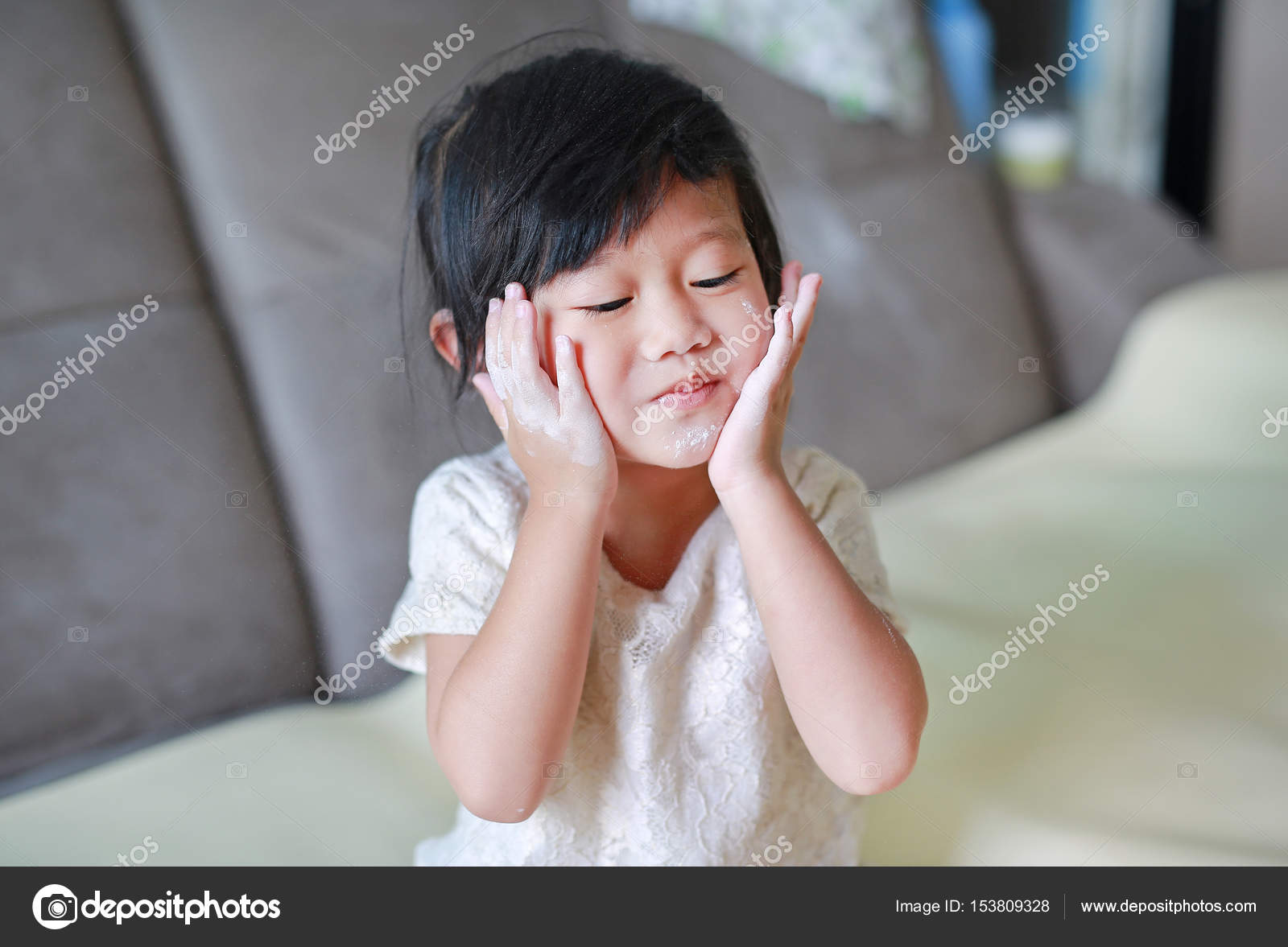putting baby powder on face