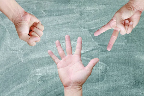 Rock, Paper, sax - händer isolerade på blackboard bakgrund — Stockfoto