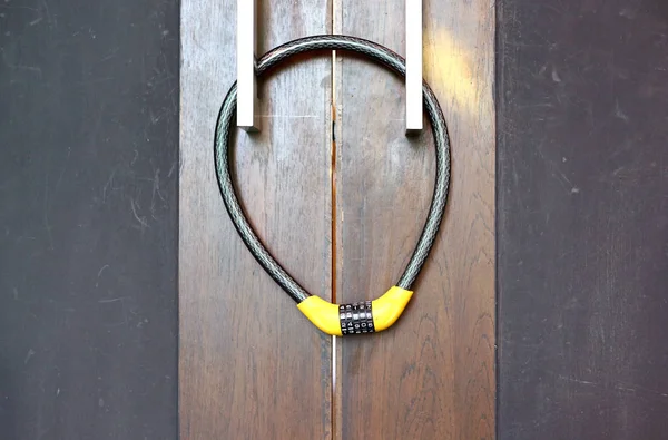 Wood door with chain Code locked.