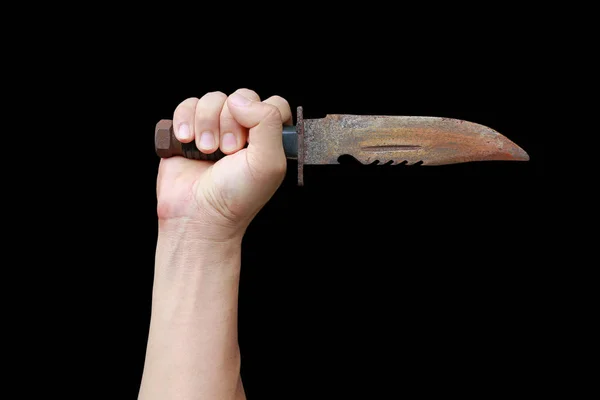 Hand holding rusty old knife with black leather handle isolated on a black background — Stock Photo, Image