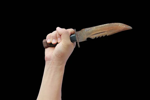 Mão segurando velha faca enferrujada com alça de couro preto isolado em um fundo preto — Fotografia de Stock