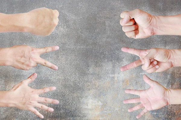 Many hands of Rock ,Paper ,Scissors - hands on grunge wall background, Creative concept.