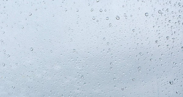 Krople deszczu na oknie szkło — Zdjęcie stockowe