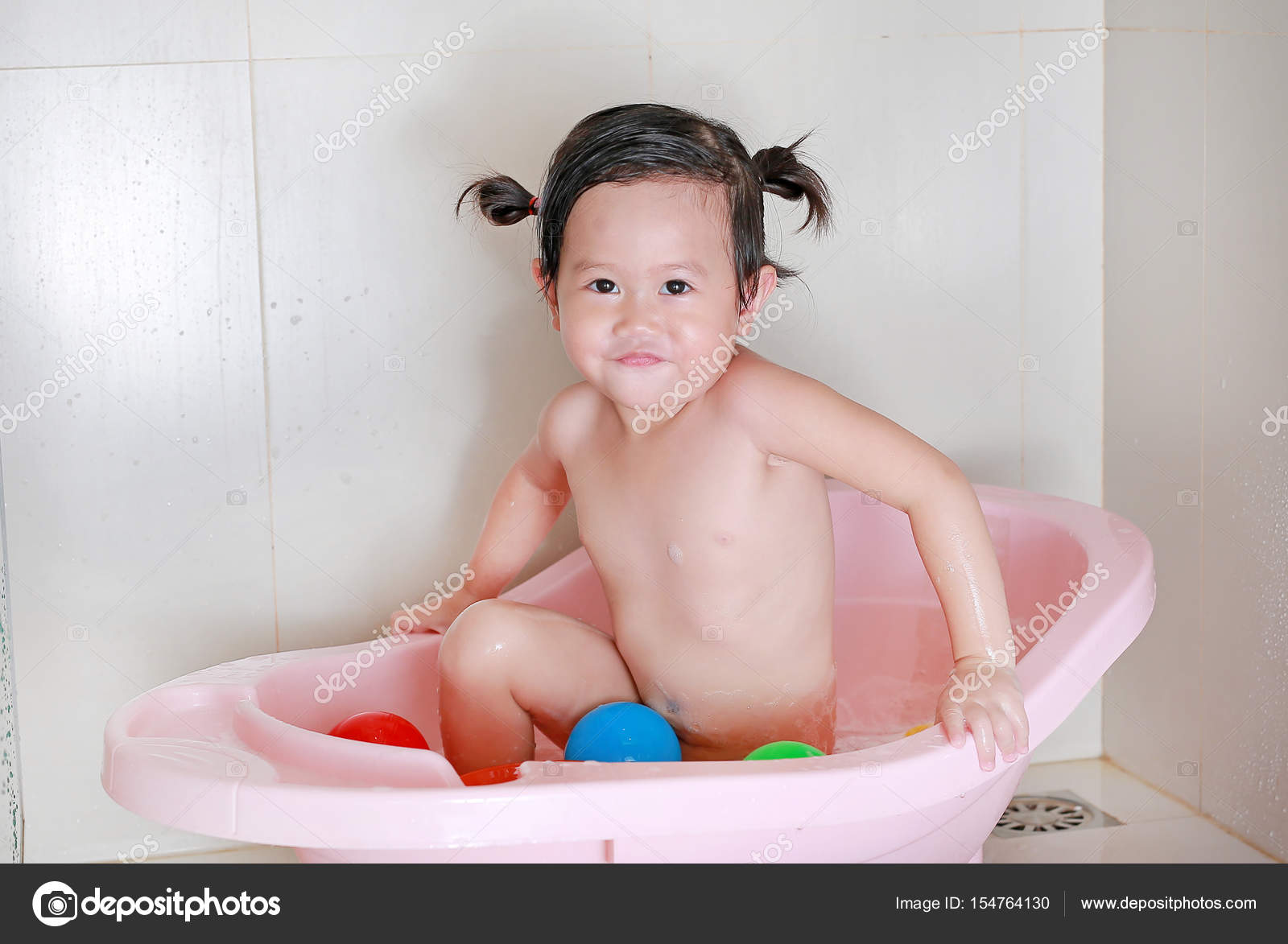 bath child girl Little girl bathes in a pink bath with a toy — Stock Photo ©  civic_dm@hotmail.com #154764130
