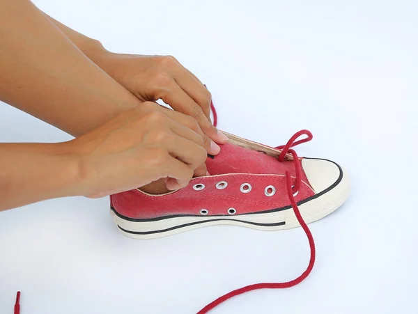 Legare le scarpe di tela scarpe da ginnastica su sfondo bianco — Foto Stock