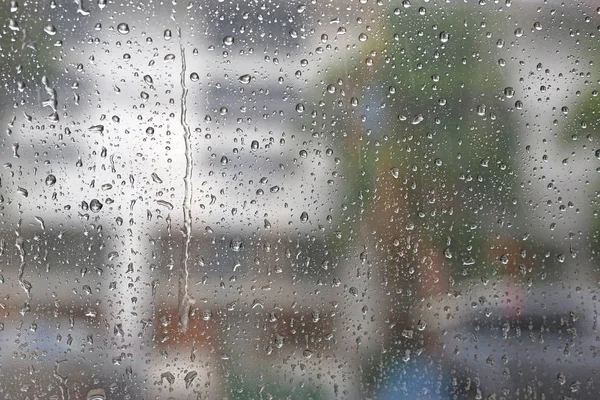 Backgroud natura kropla świeżej wody na szkło i deszcz — Zdjęcie stockowe