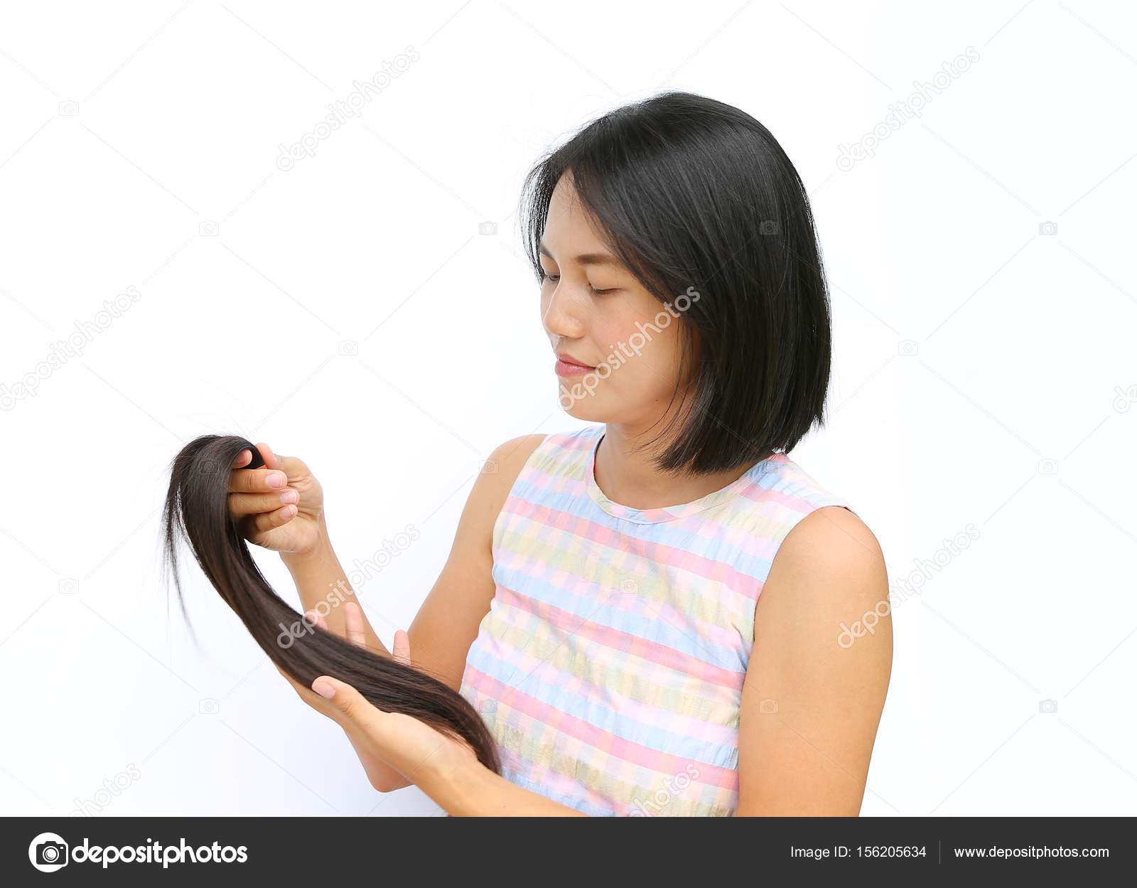 Asian Woman Donating Her Hair To Cancer Patients Holding Her