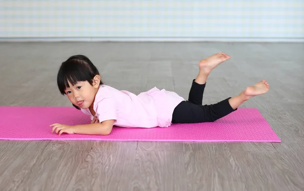 Kid girl doing exercise