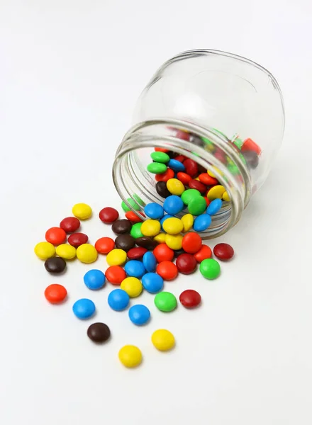 Colorful sugar-coated chocolate smarties on a white background Stock Picture