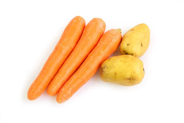 Carrot and potatoes on white plate — Stock Photo, Image