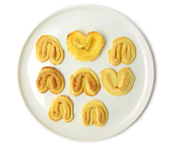 Biscuits on white plate against white background — Stock Photo, Image