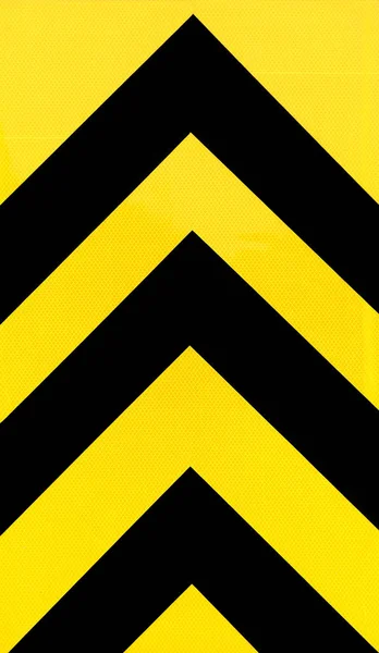 黄色と黒の矢印の背景 — ストック写真