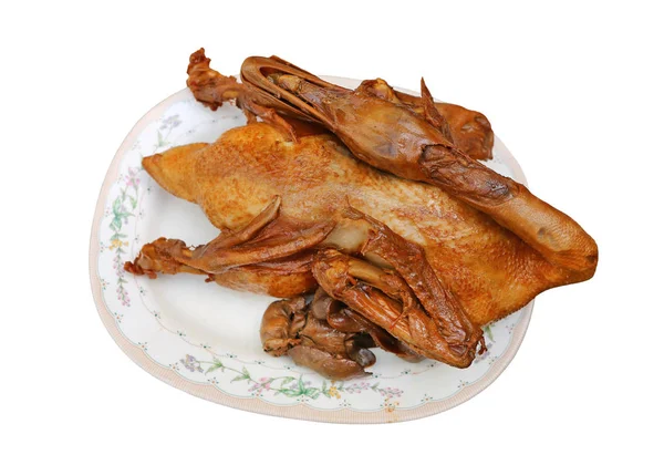 Pečená kachna na talíři izolovaných na bílém pozadí — Stock fotografie
