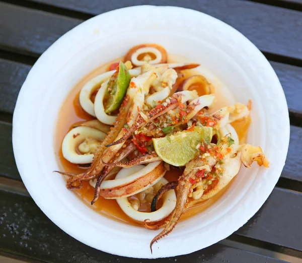 Spicy squid in white plate — Stock Photo, Image