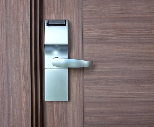 modern stainless with card insert handle on wood door