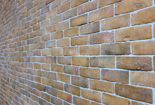 Ceglany mur teksturę tła, wybrane koncentrują się na powierzchni cegły połowie ściany — Zdjęcie stockowe