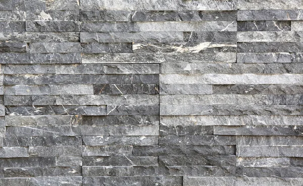 Moderne grijze steen tegel textuur bakstenen muur — Stockfoto