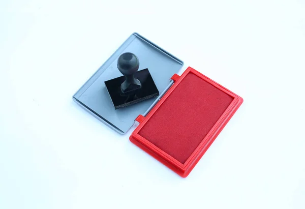 Rubber stamp and Red Ink cartridges on white background. — Stock Photo, Image