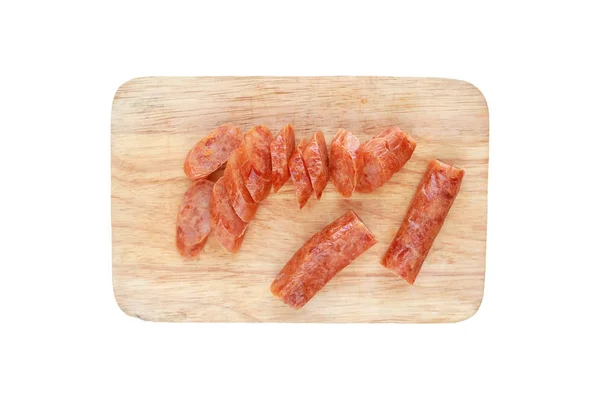 Sliced Chinese sausages on chopping block isolated on white background — Stock Photo, Image