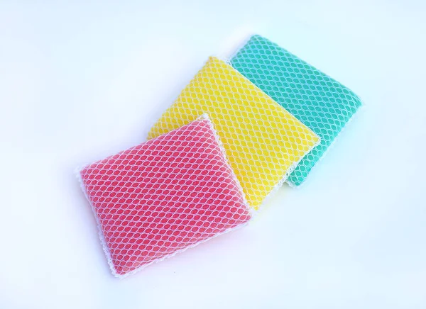multi-colorful kitchen sponges for ware washing on white background