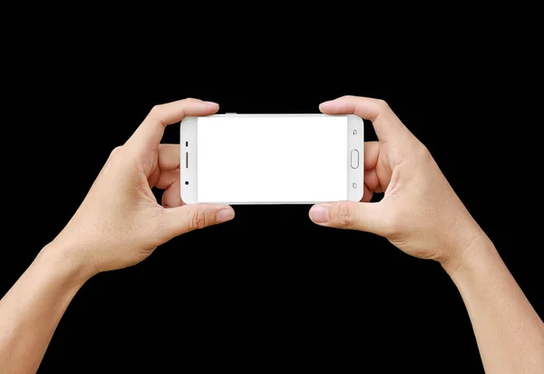 Mână care deține smartphone mobil cu ecran alb. Conceptul de fotografie mobilă. Izolat pe negru . — Fotografie, imagine de stoc