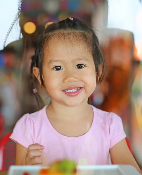 Kid girl in restaurant with reflection