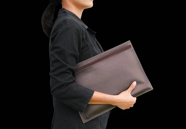Business woman with leather bag isolated on black background