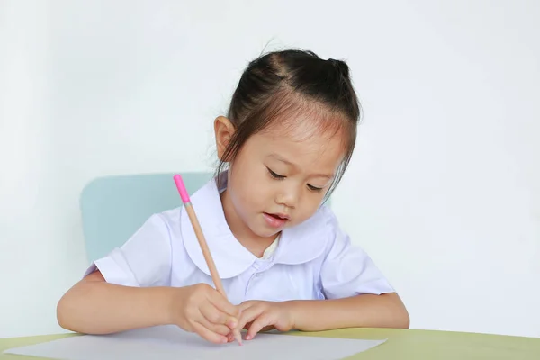Asiatiska Barn Skoluniform Som Med Penna Som Skriver Tabell Isolerad — Stockfoto