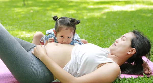 Little Child Girl Kissing Belly Pregnant Women Garden — Stock Photo, Image