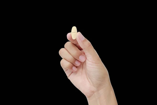 Hand Holding Yellow Pill Isolated Black Background — Stock Photo, Image