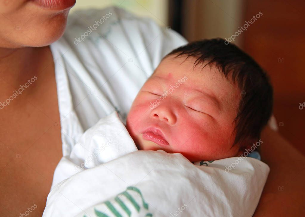 Newborn infant Aged 2 Days sleep on mother's chest