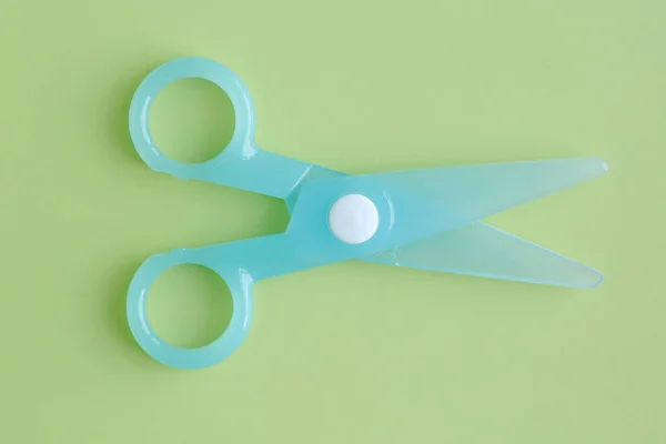 Cyan Plastic Children Safety Scissors Green Background — Stock Photo, Image