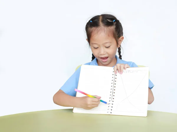 Smiling Little Child Girl School Uniform Show Writing Blank Notebook — ストック写真