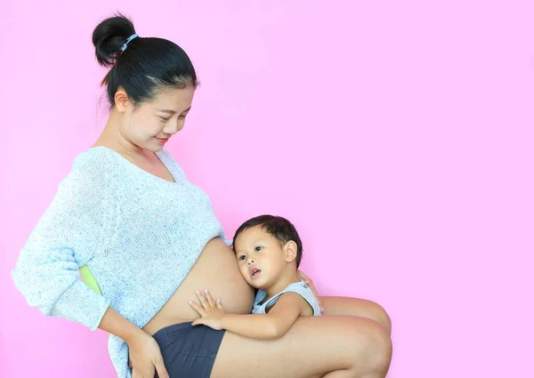 Asian Baby Boy Listening Baby Tummy Pregnant Mother Isolated Pink — Stock Photo, Image