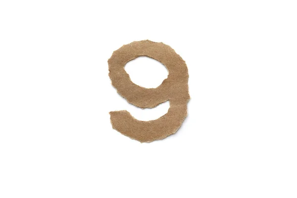 アラビア数字のシンボルは白い背景に隔離されています 英語平茶色の破れた紙の番号9 — ストック写真