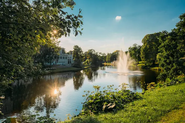 Riga, Latvia. City River Canal In The Park Bastion Hill. Sun Shi