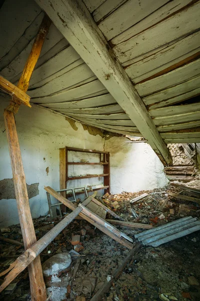 Interior Of Ruined Abandoned Country House With Caved Roof, Evacuation Zone After Chernobyl Disaster