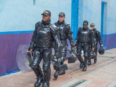 Bogota.  Armed riot police on the streets of Bogota clipart